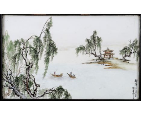 A pair of Chinese famille verte porcelain panels, decorated a pagoda overlooking a river with a log barge and other vessels, 