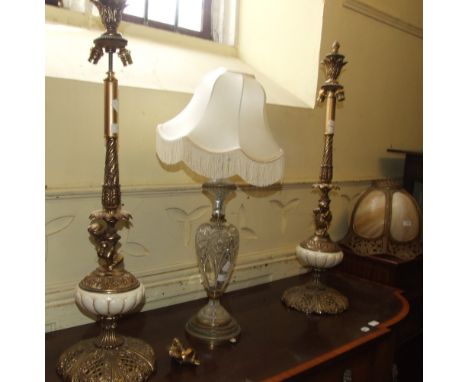 A pair of gilt metal table lamps, and a cut glass lamp (a.f.) (3)