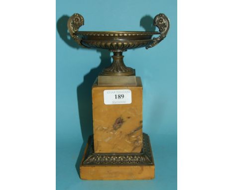 A brass urn, on a sienna marble base, 23.5 cm high