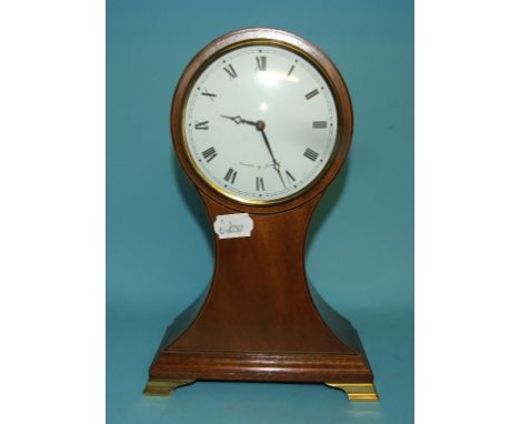 An Edwardian style mantel clock, the white dial with Roman numerals signed Comitti of London, in an inlaid mahogany case, 29.