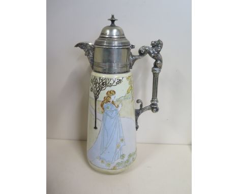 An Art Nouveau ceramic claret jug with a plated top and handle, marked RC and Co, 28cm tall, generally good, some wear to pla