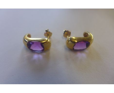 A pair of hallmarked 18ct amethyst set earrings, 15mm long, approx 4.6 grams, in good condition 