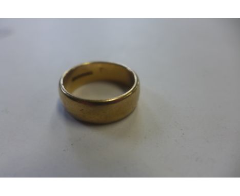 A hallmarked 9ct yellow gold band ring, size T, approx 9 grams 