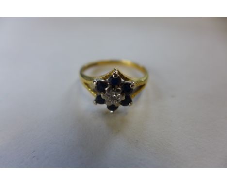 An 18ct gold diamond and sapphire ring, approx 3.6 grams, size M, some wear but generally good 