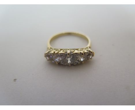 An 18ct yellow gold Edwardian five stone diamond ring, interspersed with eight smaller diamonds, approx 1.85ct total size N, 