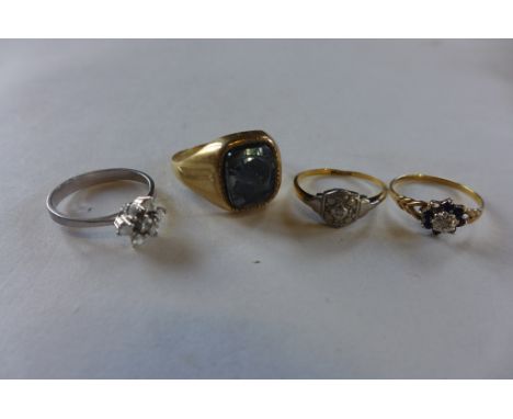 An 18ct diamond ring, approx 1.8 grams, two 9ct rings, approx 5.6 grams and a white metal ring, approx 1.9 grams 