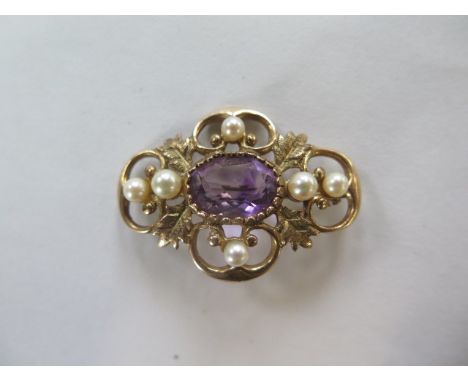 A 9ct hallmarked amethyst and pearl brooch, approx 7.4 grams, 3.5 x 2.5cm - generally good