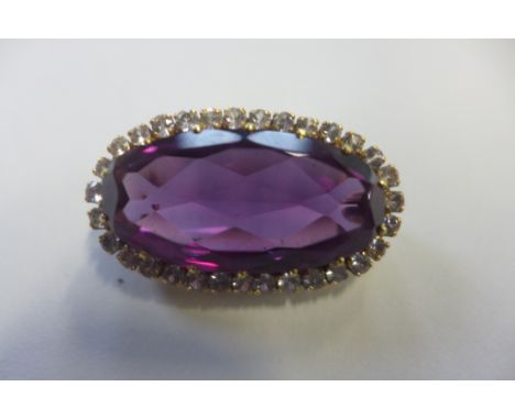 A 9ct gold amethyst and white stone brooch, not hallmarked but stamped 9ct to pin and tests as 9ct, total weight 16.7 grams, 