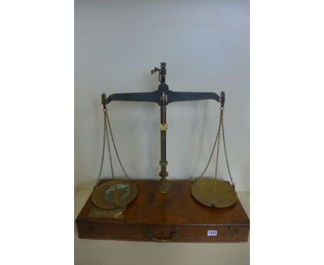 A 7lb brass beam scale by De Grave and Co, London, in fitted oak case 