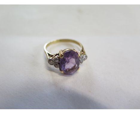 An 18ct yellow gold amethyst and diamond ring, size P, amethyst approx 12x8mm, approx 4.5 grams, in generally good condition,