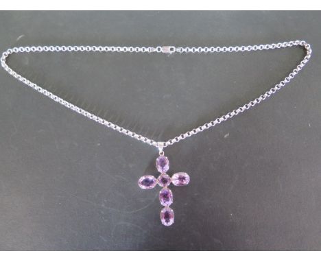 A large silver and amethyst cross set with five oval and one round amethyst stones, oval stones measure 14mm x 11mm - cross m