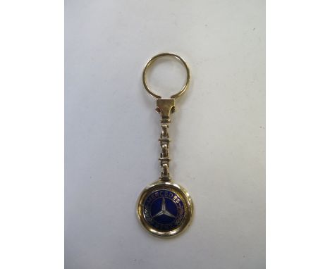 A 14ct yellow gold Mercedes Benz key ring marked 585, total weight approx 17.7 grams, some general marks consistent with usag