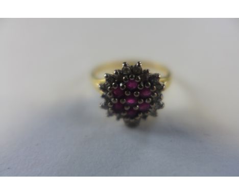 A hallmarked 18ct ruby and diamond gold ring, size K, approx 2.8 grams, generally good 