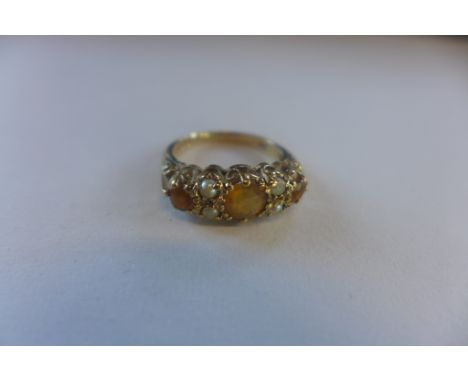 A hallmarked 9ct ring, set with citrine and seed pearls with ornate pierced setting, size K, approx 3 grams, some small wear 