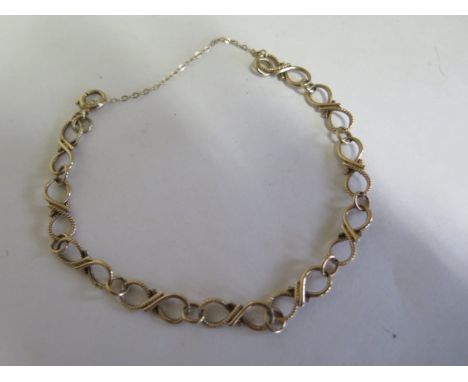 A 9ct yellow gold link bracelet, figure 8 links, part plain and part rope link, bolt ring fastening, 9ct Birmingham 1966/7 we