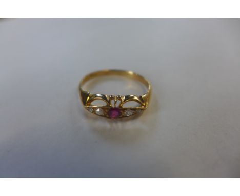 A hallmarked 18ct yellow gold diamond and ruby ring, size S, approx 2.3 grams, some wear but no obvious damage 