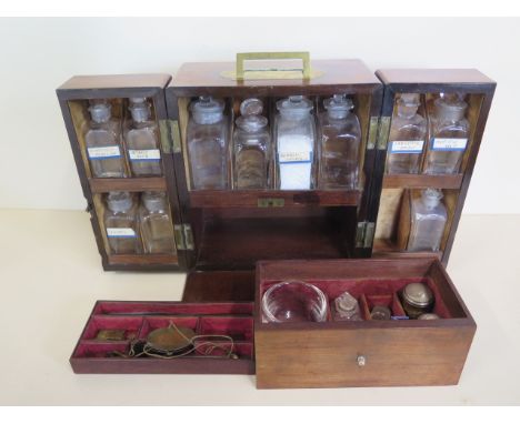 A good early 19th century brass mounted mahogany apothecary chest, fitted with eleven glass jars, scales and other accessorie