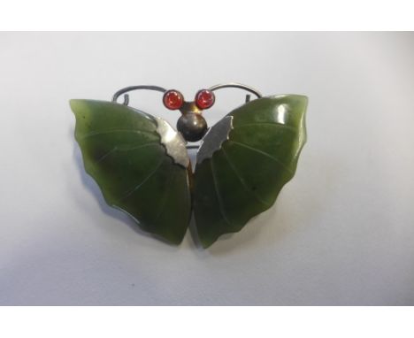 A white metal and jade butterfly brooch, width 48mm, in good condition 