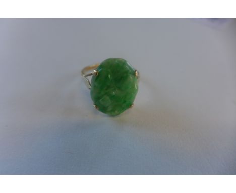 A 9ct ring, set with carved jade stone, marked 9ct, size L, approx 2.8 grams, generally good 