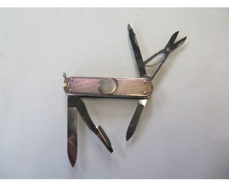 A silver Victorinox penknife, two blades, scissors and two other attachments, generally good, some bending to spring, hallmar