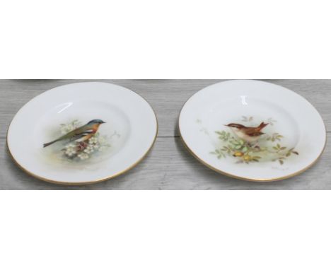 Royal Worcester -&nbsp;two small porcelain plates with bird decoration signed W. Powell, factory stamp and title to the under