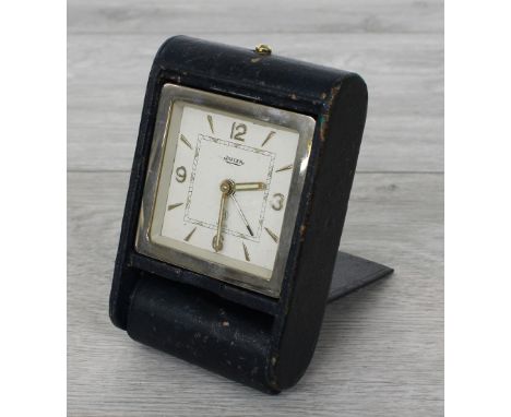 Jaeger LeCoultre 8-day travel clock, within a folding blue leather case 42 long overall (at fault) 