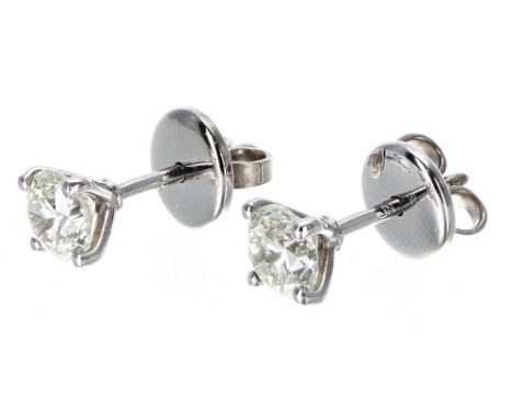 Pair 18ct white gold four claw round brilliant-cut diamond solitaire stud earrings, 1.04ct approx in total, clarity SI, colou