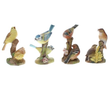 Royal Worcester&nbsp;-&nbsp;group of four porcelain figural group of birds perched on branches; including 3377 yellow hammers