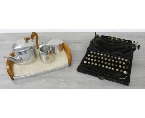 Vintage Piquot Ware stainless steel three piece tea service on tray;&nbsp;together with a vintage Remington typewriter (at fa