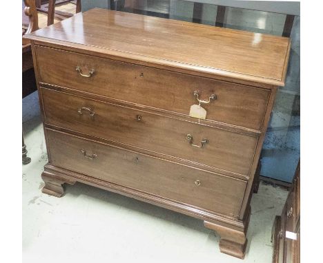 CHEST, George III mahogany with three long graduated drawers raised on ogee bracket supports, 78cm H x 109cm x 59cm. (with fa