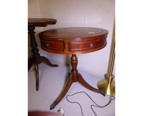 MAHOGANY DRUM TABLE. Mahogany drum table with leather inset on tripod base, D ~ 51cm