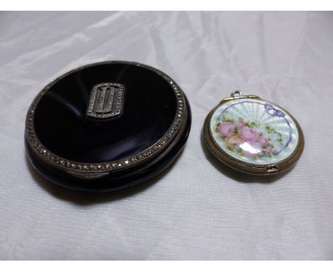 TWO SILVER AND ENAMEL COMPACTS. Two silver and enamel compacts