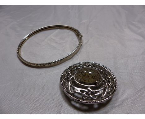 BROOCH AND BANGLE. Celtic brooch and silver hinged bangle