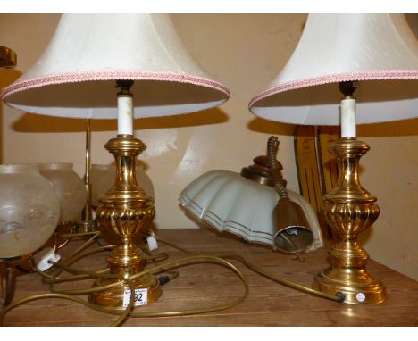 BRASS LAMPS AND LIGHT FITTINGS. Three brass ceiling light fittings and two brass lamps with shades