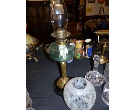 BRASS AND GLASS PARAFFIN LAMP. Brass and coloured glass paraffin lamp with shade A/F, H - 69cm