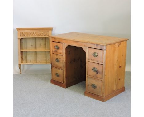 A pine kneehole desk, 108cm, together with a pine hanging wall shelf