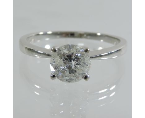 An 18 carat white gold solitaire diamond ring, 1.32 carat, with valuation, boxed