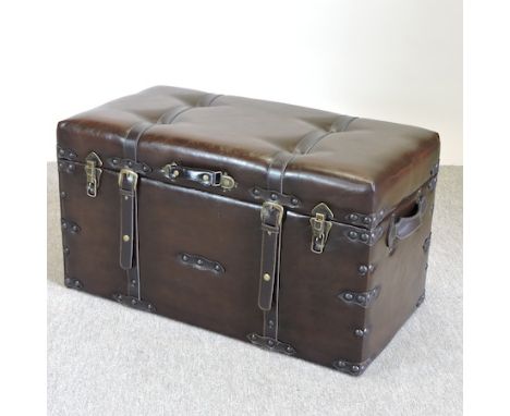 A brown leather trunk, 