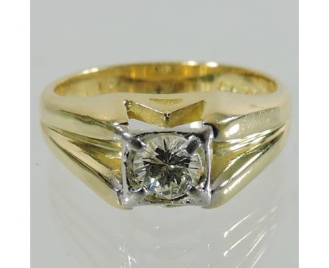 An 18 carat gold and diamond single stone ring, 0.65 carat