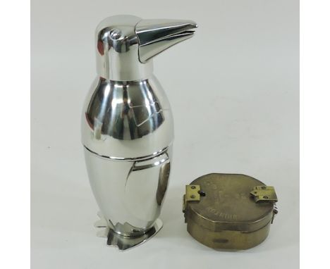 A reproduction brass compass, together with a plated cocktail shaker in the form of a penguin, 19cm tall
