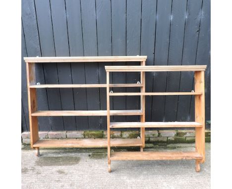 A pine hanging wall shelf, 125cm, together with another smaller