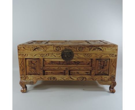 A small Chinese carved hardwood trunk, 70cm