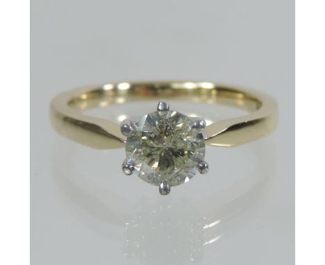 An 18 carat gold solitaire diamond ring, approximately one carat, boxed 