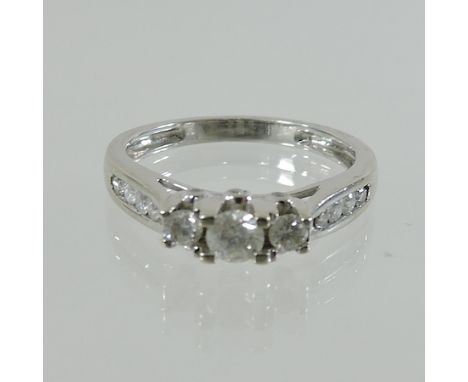 A 10 carat white gold and diamond ring