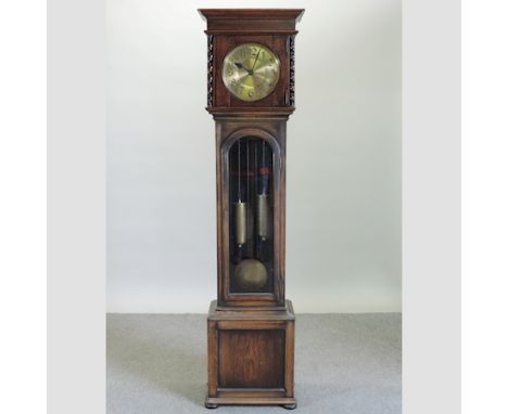 A 1920's oak cased longcase clock, 192cm tall