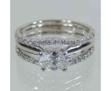 A modern 18 carat white gold marquise cut diamond ring, boxed 