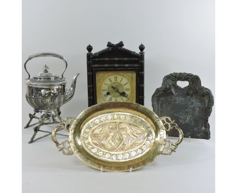 An early 20th century mantel clock, 33cm tall together with two metal trays and a Victorian silver plated kettle, on stand