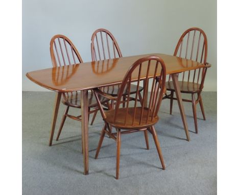 An Ercol dining table, 150 x 76cm, together with a set of four dining chairs and a matching sideboard 