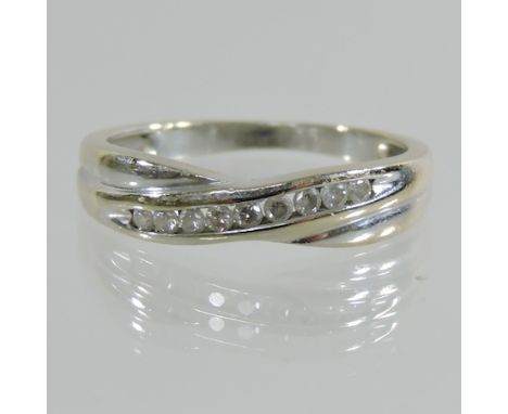 An 18 carat white gold eternity ring, boxed