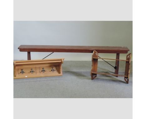 A folding hardwood bench, 183cm, together with a hanging shelf and coat rack 